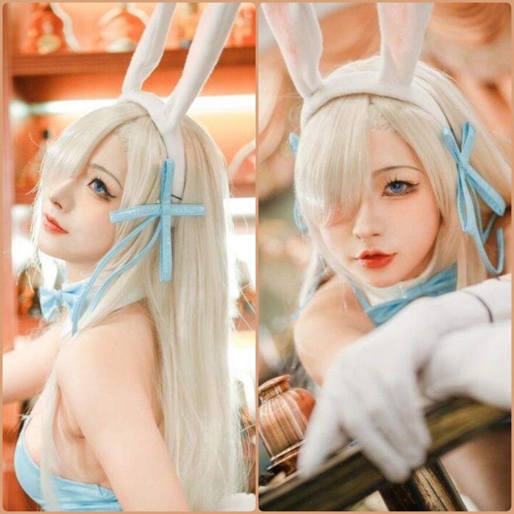 yuuhui玉汇身穿紧身黑色职业装OL制服，搭配高跟鞋和黑丝，眼神冷艳，展现修长美腿